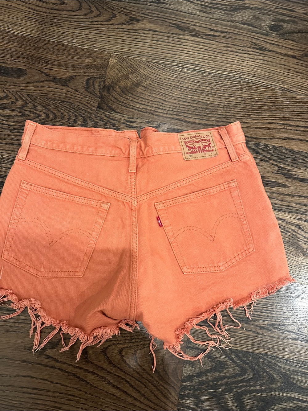 Levi's Coral-Orange Denim Cutoff Shorts with Frayed Hem